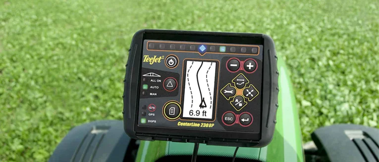 A GPS guidance unit fitted to a tractor cab